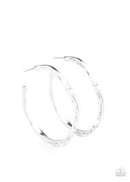 Delicately hammered in shimmery textures, a flat silver bar curls into an asymmetrical hoop for a trendy vibe. Hoop measures approximately 1 1/2" in diameter. Sold as one pair of hoop earrings.