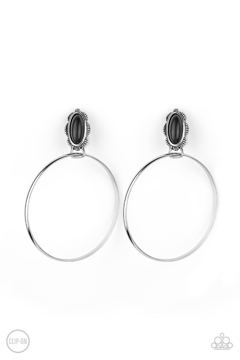 A shimmery silver hoop is threaded through the bottom fitting of an earthy black stone dotted floral silver frame, creating a whimsical display. Earring attaches to a standard clip-on fitting. Sold as one pair of clip-on earrings.