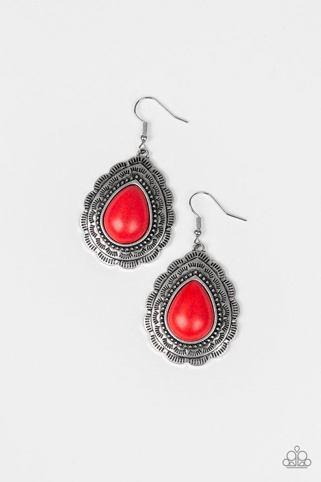 Chiseled into a tranquil teardrop, a fiery red stone is pressed into a scalloped silver frame radiating with tribal inspired patterns for a seasonal look. Earring attaches to a standard fishhook fitting. Sold as one pair of earrings.