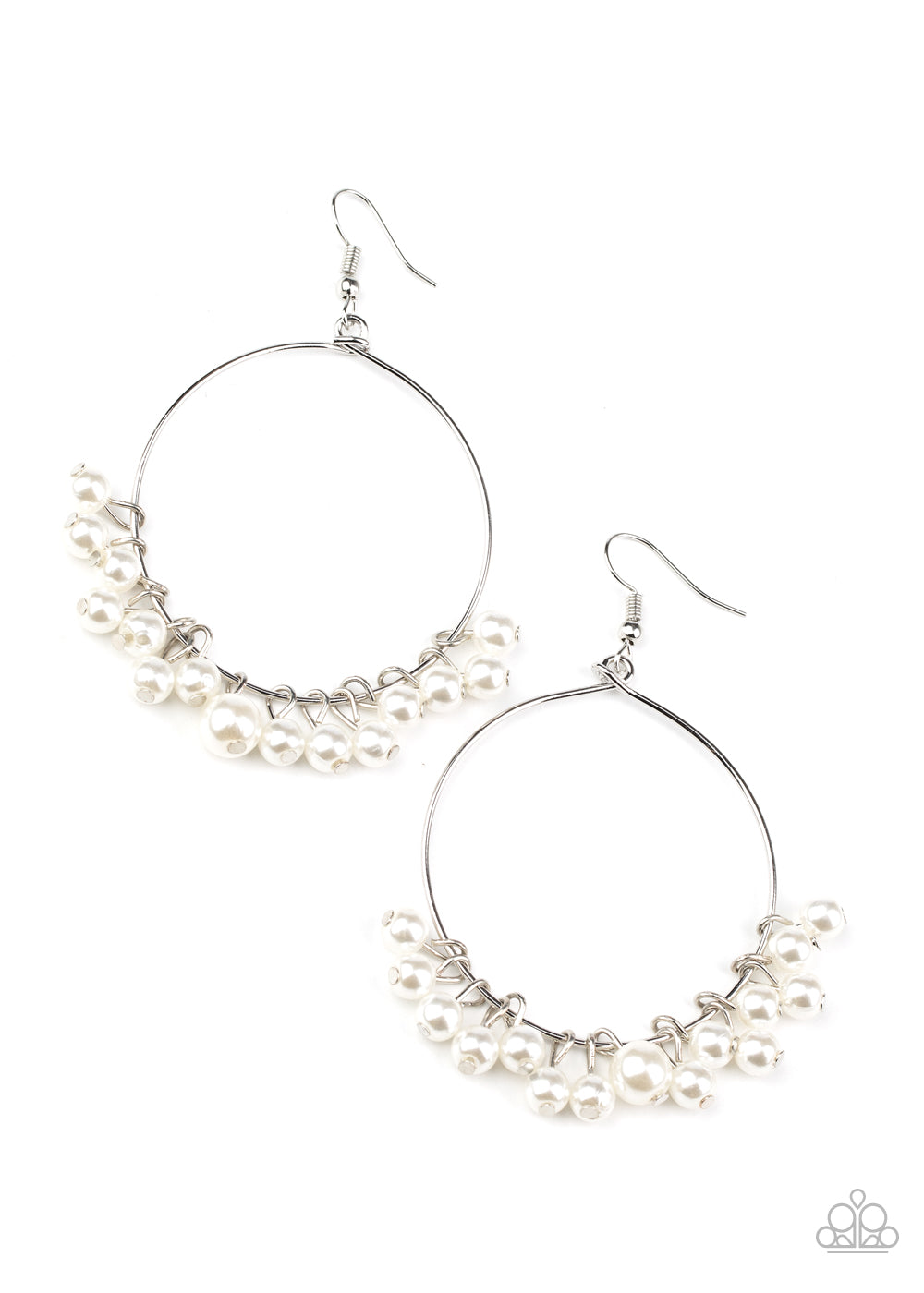 Bubbly white pearls swing from the bottom of a dainty silver hoop, creating a refined fringe. Earring attaches to a standard fishhook fitting.
Sold as one pair of earrings.