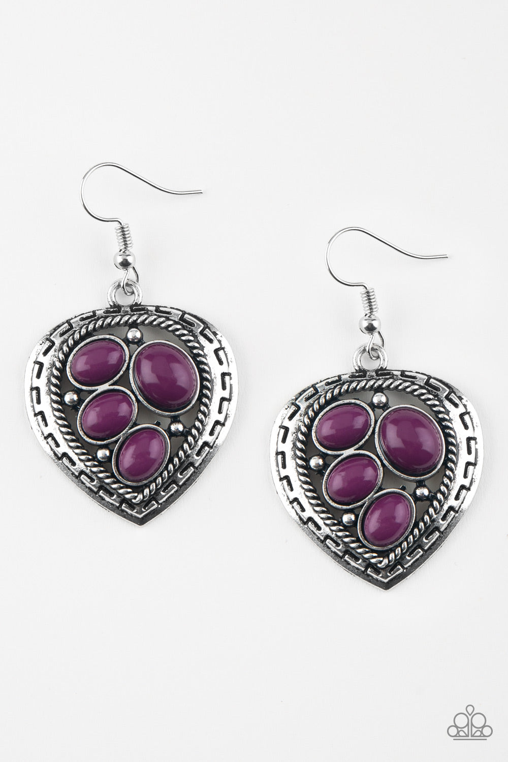 Varying in size, polished purple beads are sprinkled across the center of an asymmetrical heart-shaped frame for a whimsical look. Earring attaches to a standard fishhook fitting. Sold as one pair of earrings.