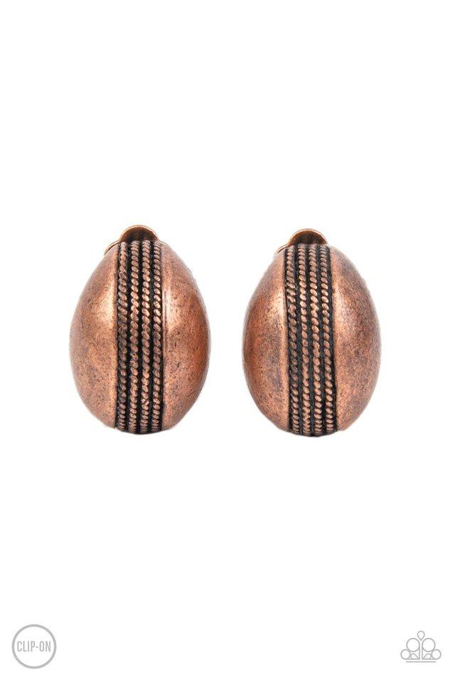 The center of a round copper frame is embossed in textured columns, accentuating the frame's dainty curve. Earring attaches to a standard clip-on fitting. Sold as one pair of clip-on earrings.