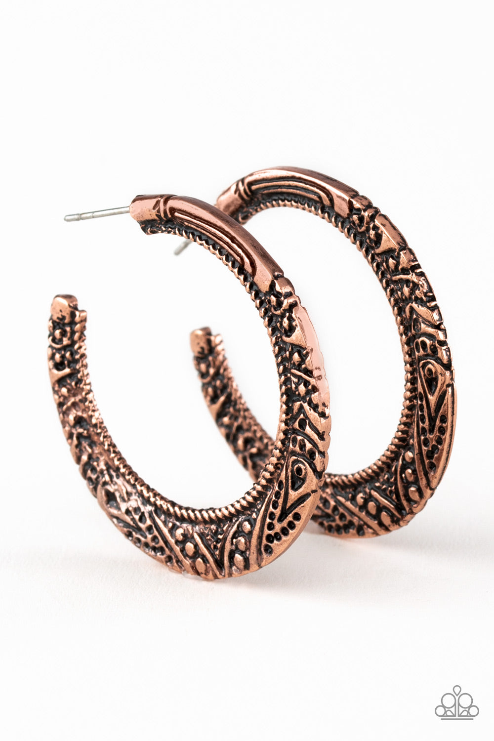 Stamped in tribal inspired patterns, a flattened copper bar curls around the ear for a seasonal look. Earring attaches to a standard post fitting. Hoop measures 1 1/2" in diameter. Sold as one pair of hoop earrings.