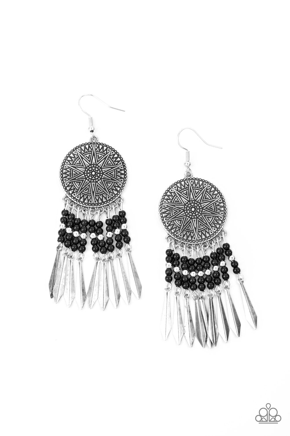 Silver and black beaded tassels swing from the bottom of an oversized silver disc embossed in an antiqued sunburst. Flared silver bars attach to the bottoms of the beaded tassels, creating an edgy fringe. Earring attaches to a standard fishhook fitting. Sold as one pair of earrings.