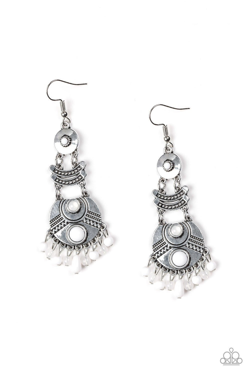 Dotted in studded textures, an array of round and crescent-shaped silver frames link into a stacked lure. Varying in size and shape, glassy and polished white beads are pressed into the ornate frames, while a matching beaded fringe swings from the bottom. Earring attaches to a standard fishhook fitting.
Sold as one pair of earrings.