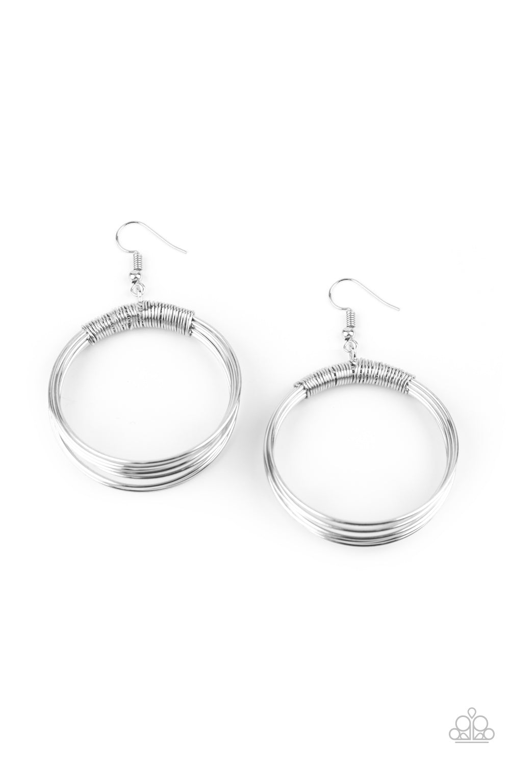 Dainty silver wire delicately wraps around layers of coiled silver wire, creating an edgy hoop. Earring attaches to a standard fishhook fitting.
Sold as one pair of earrings.