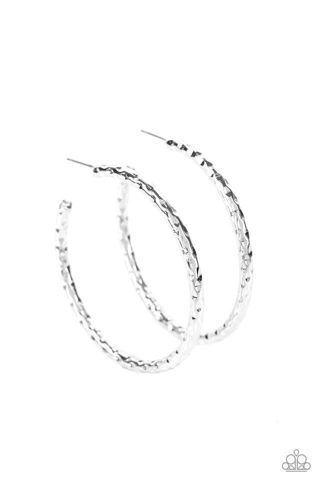 Hammered in blinding shimmer, a thick silver hoop curls around the ear for an edgy, urban look. Earring attaches to a standard post fitting. Hoop measures approximately 2" in diameter. Sold as one pair of hoop earrings.
