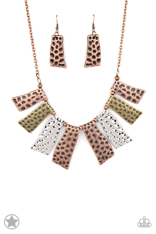 Abstract wavy plates of copper, silver, and brass are texturized with eye-catching hammered divots and alternating copper beads along a copper chain. Features an adjustable clasp closure.  Sold as one individual necklace. Includes one pair of matching earrings.