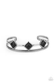 Smooth and textured silver bars are held in place by a row of tilted black stone squares, coalescing into dainty seasonal cuff around the wrist. Sold as one individual bracelet.