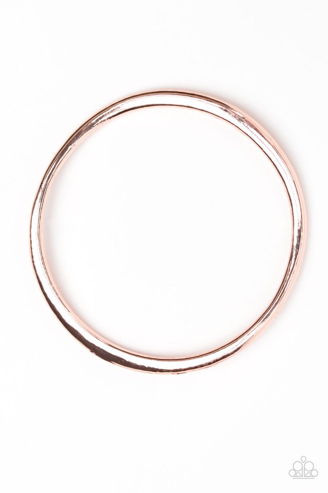Featuring a warped surface, an asymmetrical rose gold bangle slides along the wrist for an edgy look. Sold as one individual bracelet.
