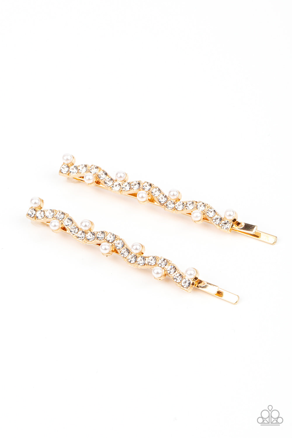 A wavy row of glittery white rhinestones is flanked between dainty white pearls along the front of a gold bobby pin for a refined fashion. Sold as one pair of decorative bobby pins.
