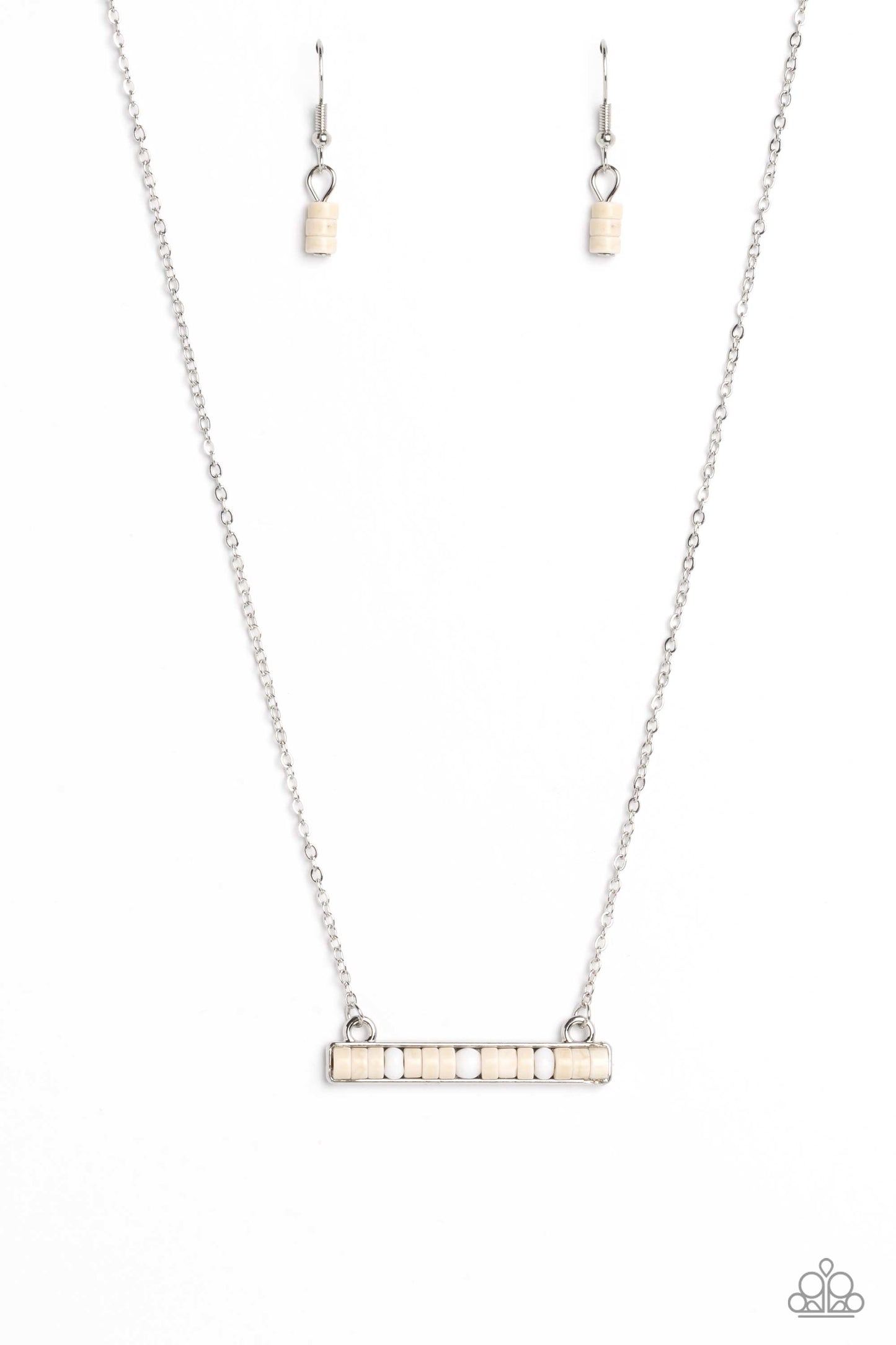 Cascading from a dainty silver chain, a collection of earthy white stone discs and beads are set in a square silver bar setting, creating an understated, harmonious display. Features an adjustable clasp closure. As the stone elements in this piece are natural, some color variation is normal. Sold as one individual necklace. Includes one pair of matching earrings.
