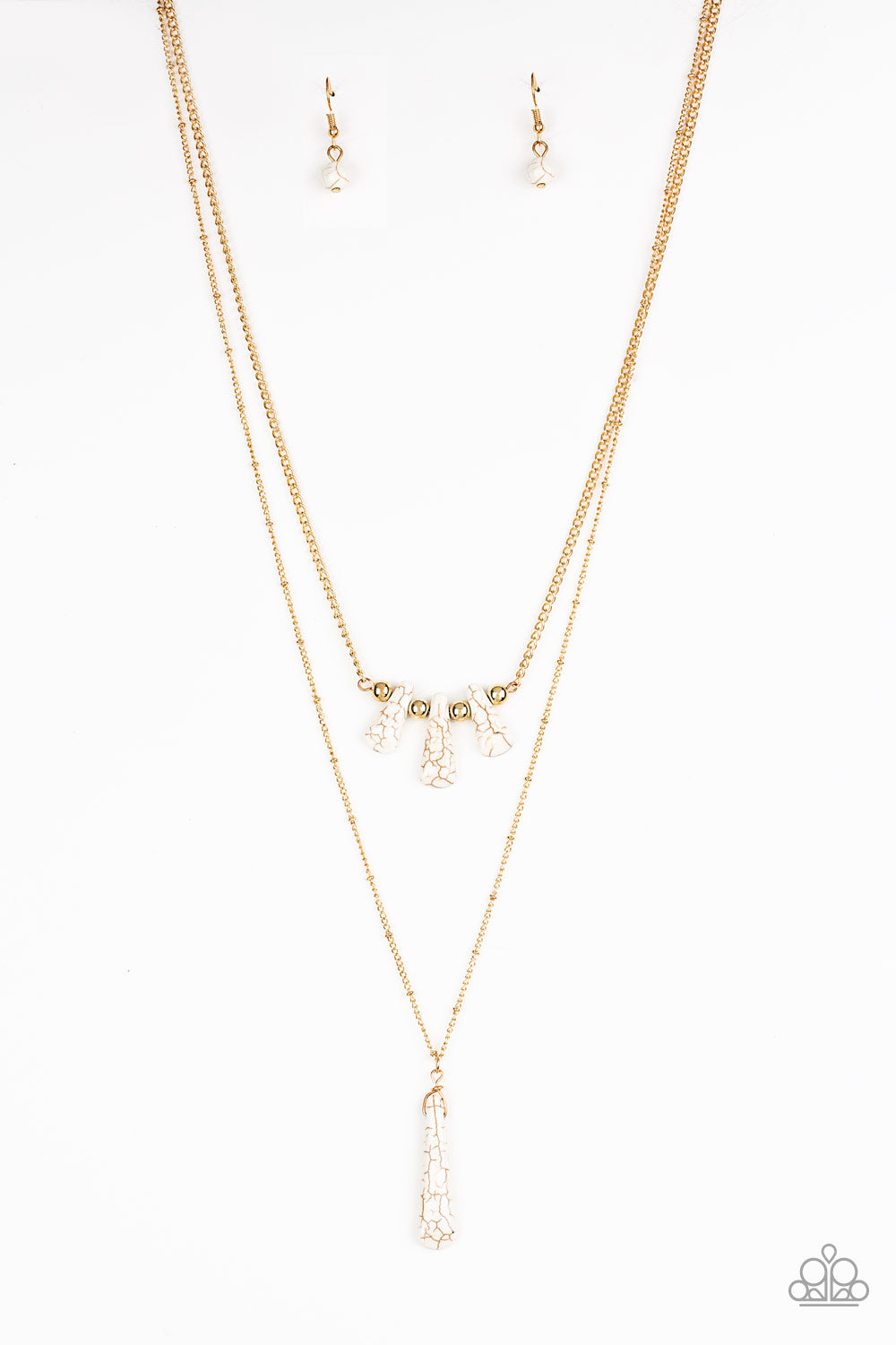 Chiseled into flared teardrop shapes, a dainty fringe of white stones and golden beads gives way to a large stone pendant, creating earthy layers down the chest. Features an adjustable clasp closure. Sold as one individual necklace. Includes one pair of matching earrings.
