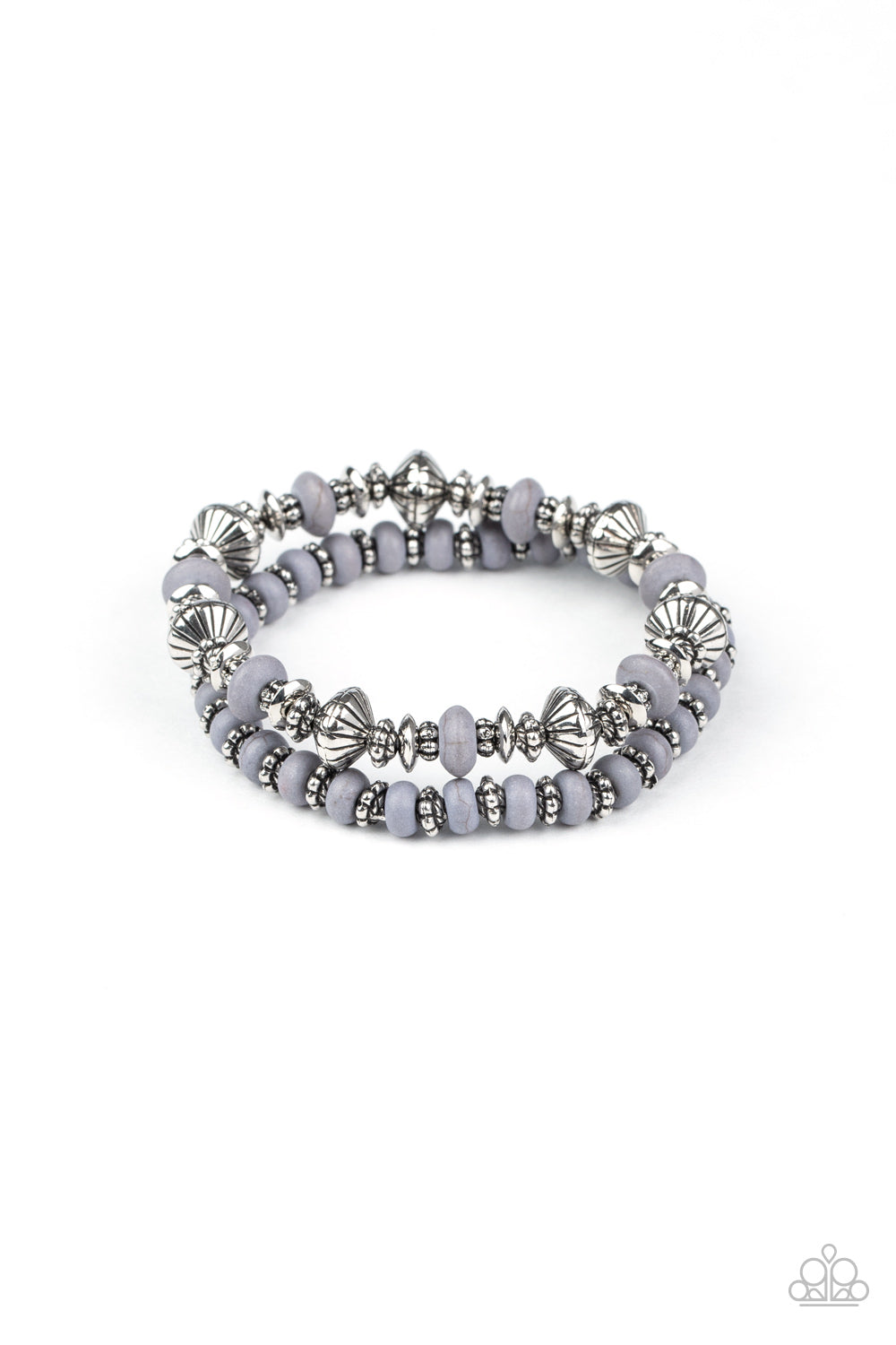 A mismatched assortment of Sleet stone beads and decorative silver beads are threaded along stretchy bands around the wrist, creating an earthy pair.
Sold as one set two of bracelets.
