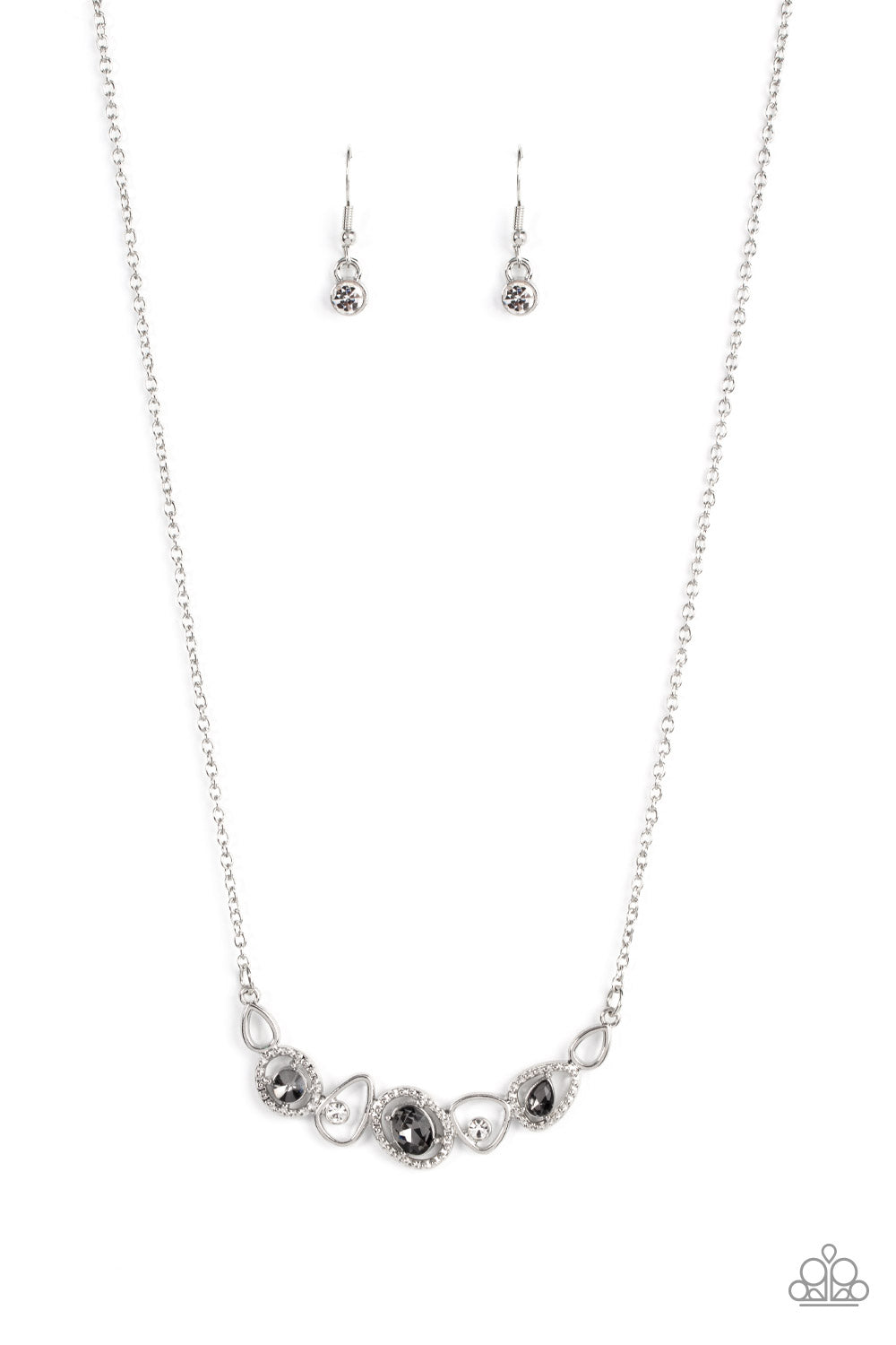 An incandescent assortment of shiny silver frames, dainty white rhinestones, and oversized smoky gems delicately coalesce into a statement-making sparkle below the collar. Features an adjustable clasp closure. Sold as one individual necklace. Includes one pair of matching earrings.
