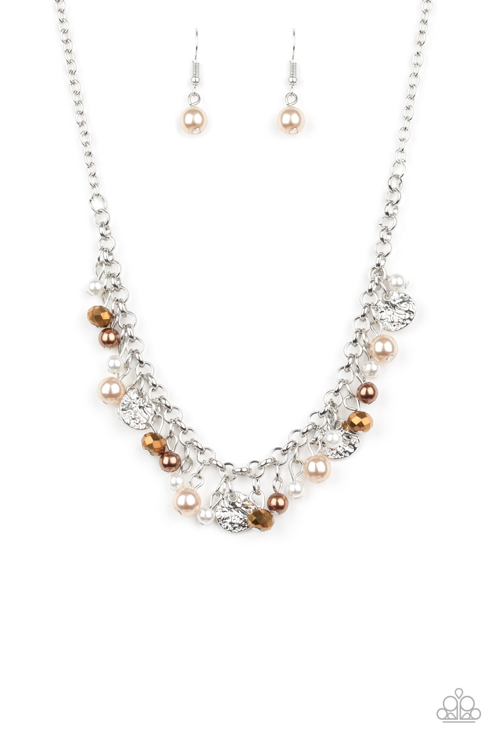 Pearly white and brown beads, aurum crystal-like gems, and hammered silver discs swing from a bold silver chain, creating a refined fringe below the collar. Features an adjustable clasp closure. Sold as one individual necklace. Includes one pair of matching earrings.