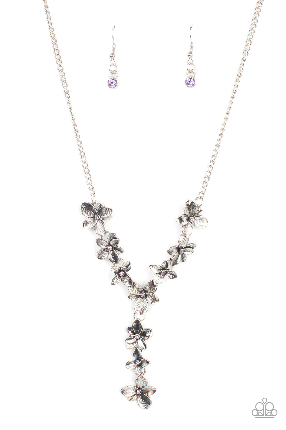 Dotted with dainty purple rhinestone centers, whimsical silver flowers delicately link into an extended pendant below the collar for an ethereal fashion. Features an adjustable clasp closure. Sold as one individual necklace. Includes one pair of matching earrings.
