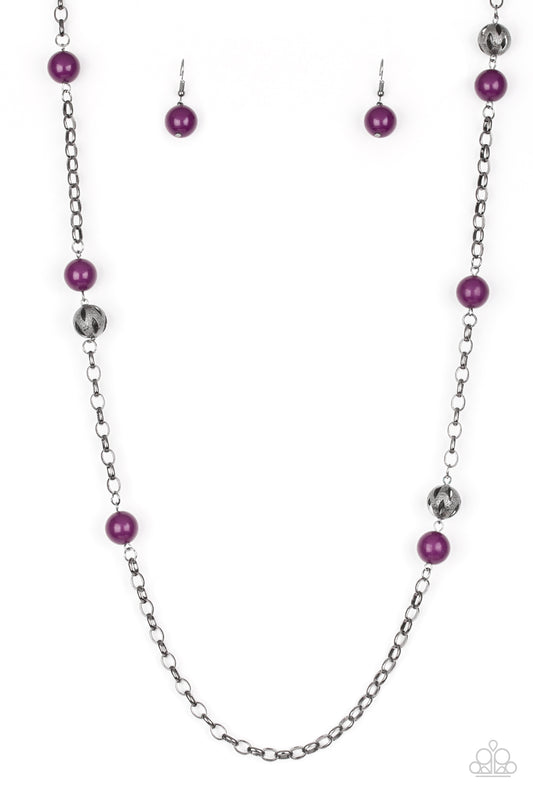 Polished purple beads and ornate gunmetal beads trickle along a bold gunmetal chain, creating a colorfully industrial look across the chest. Features an adjustable clasp closure. Sold as one individual necklace. Includes one pair of matching earrings.