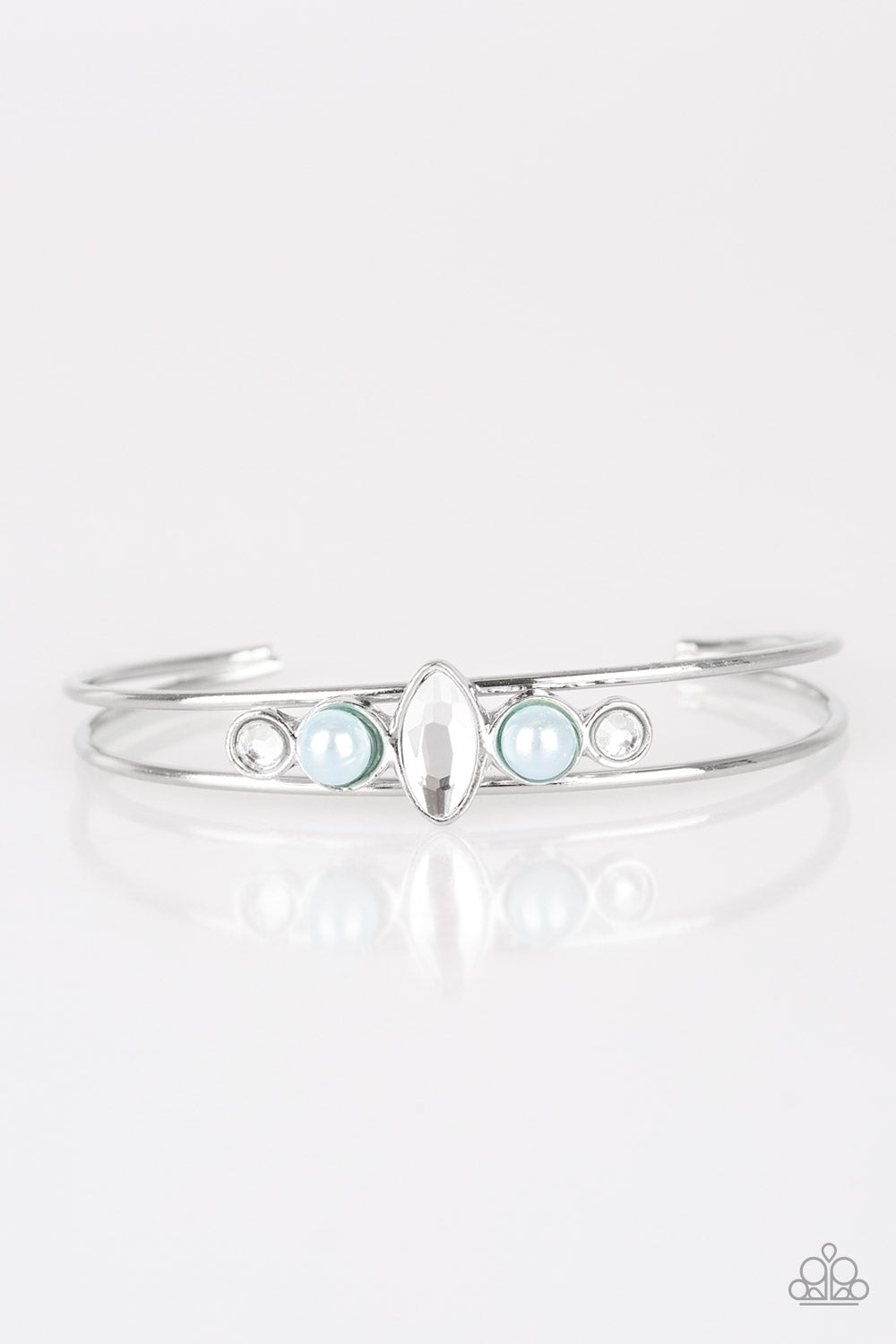 Varying in shape and shimmer, glittery white rhinestones and pearly blue beads are encrusted along the top of a dainty silver cuff for a refined look. Sold as one individual bracelet.