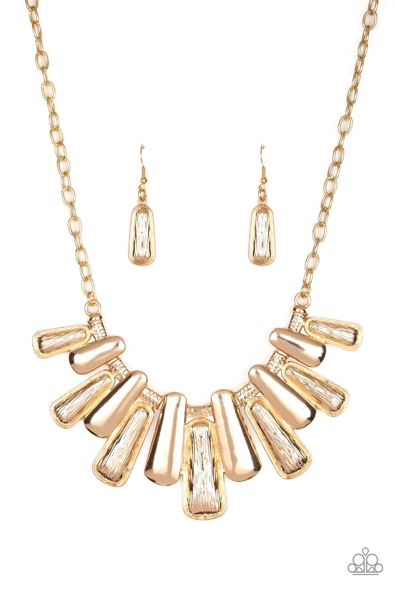 Featuring smooth and etched finishes, a collection of glistening gold plates link below the collar, creating a blinding fringe. Features an adjustable clasp closure. Sold as one individual necklace. Includes one pair of matching earrings.