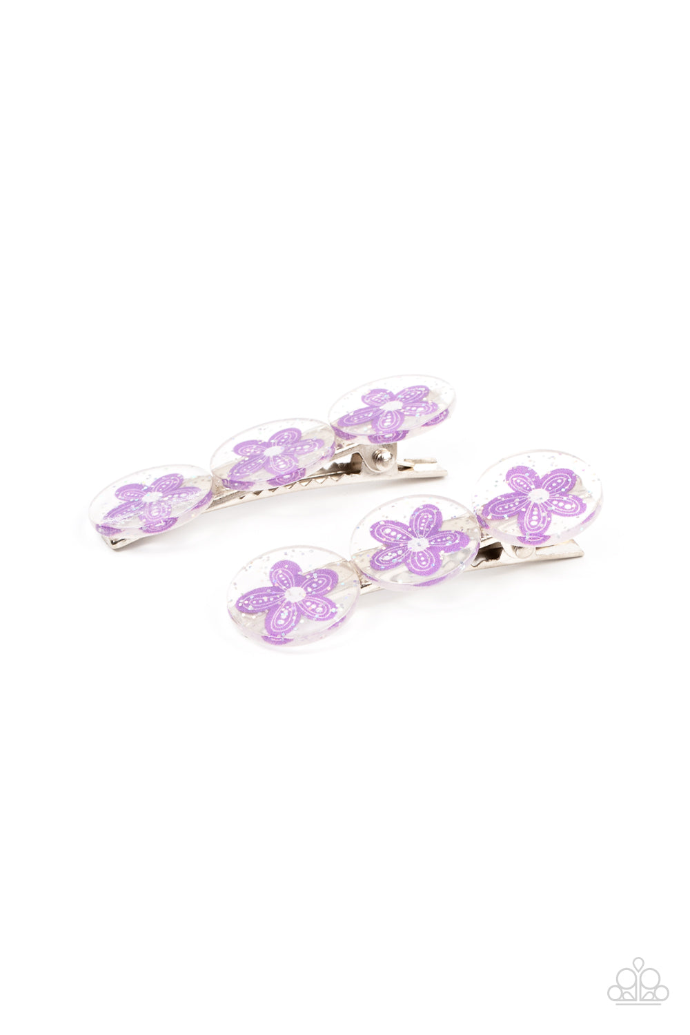 Sprinkled in silvery sparkles, trios of purple flower adorned acrylic discs join into a whimsical pair of hair clips. Features standard hair clips on the back. Sold as one pair of hair clips.