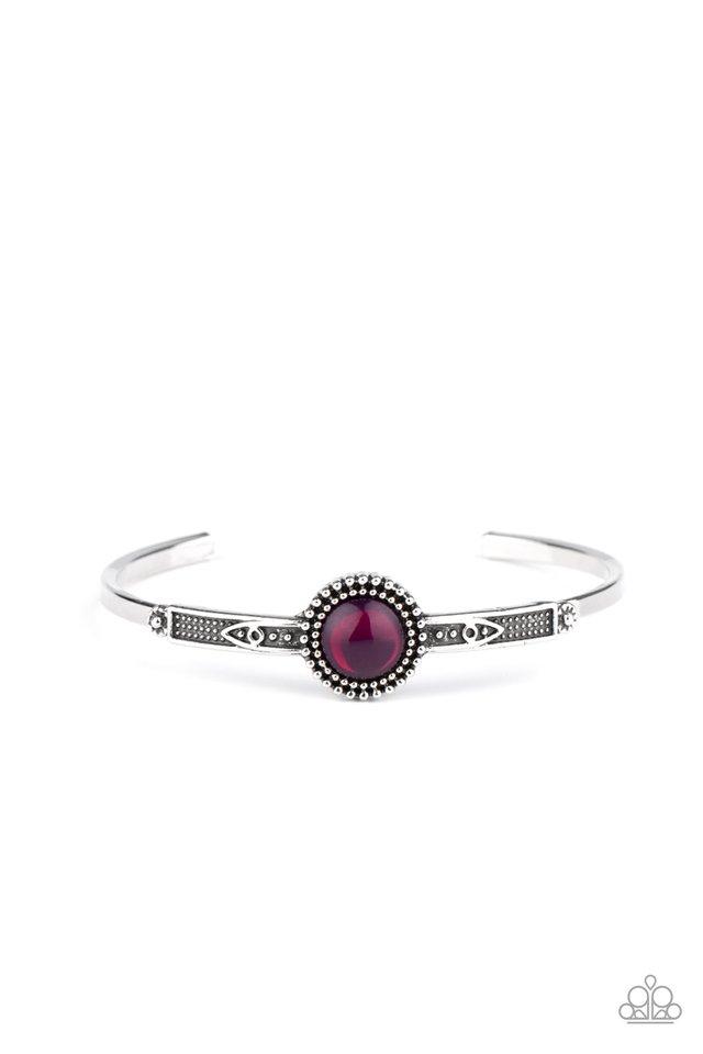 A glassy purple bead is pressed into the middle of a studded silver frame atop a decorative cuff, creating a colorfully dainty display around the wrist. Sold as one individual bracelet.