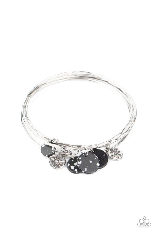 Infused with mismatched silver floral charms and speckled black stone discs, a stack of hammered silver bangles slides along the wrist for a colorful earthy look. Sold as one individual bracelet.