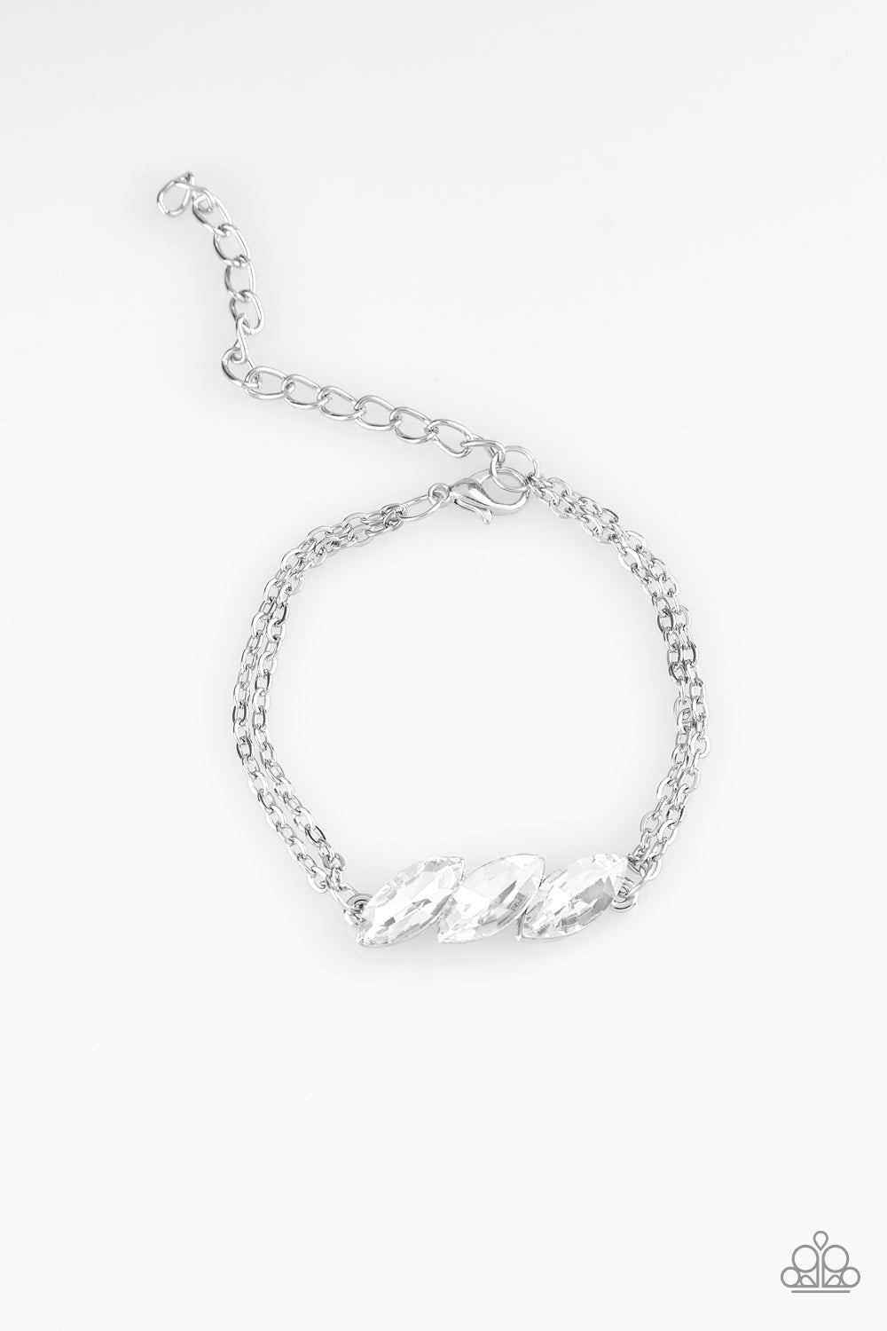 Featuring regal marquise-cuts, a trio of glittery white rhinestones join across the center of the wrist for a timeless look. Features an adjustable clasp closure.
Sold as one individual bracelet.