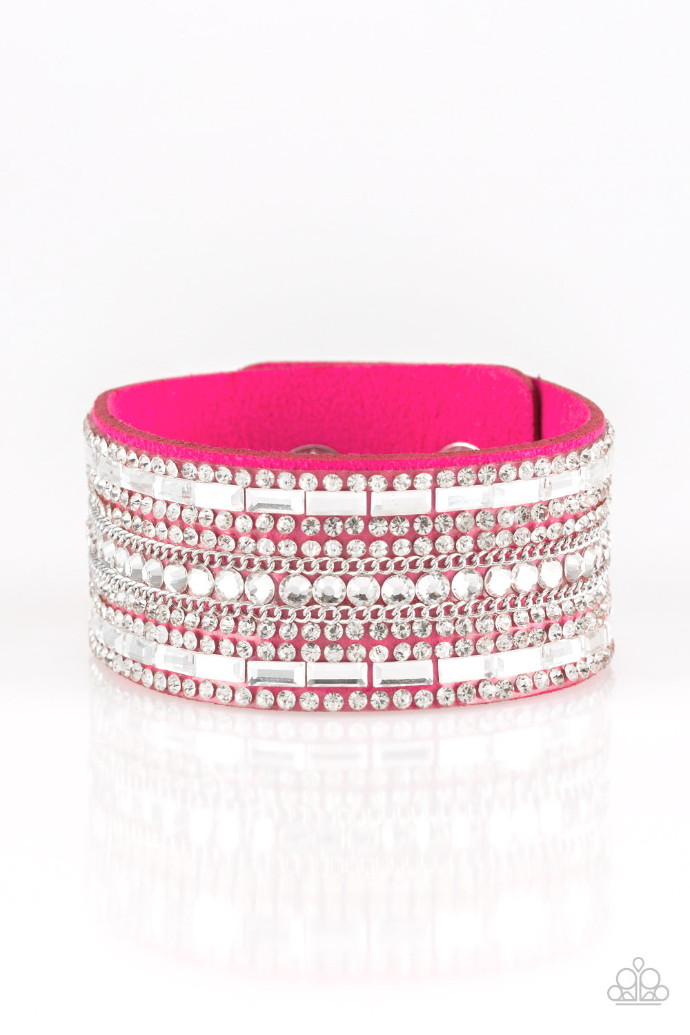 Featuring classic round and edgy emerald style cuts, glittery white rhinestones and glistening silver chains are encrusted along bands of pink suede for a sassy look. Features an adjustable snap closure. Sold as one individual bracelet.
