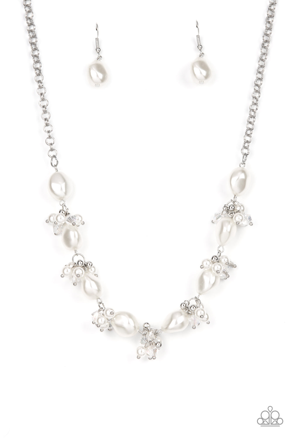 Imperfect white pearls alternate with clusters of iridescent crystals and white pearls below the collar, creating an effervescently elegant display. Features an adjustable clasp closure. Sold as one individual necklace. Includes one pair of matching earrings.