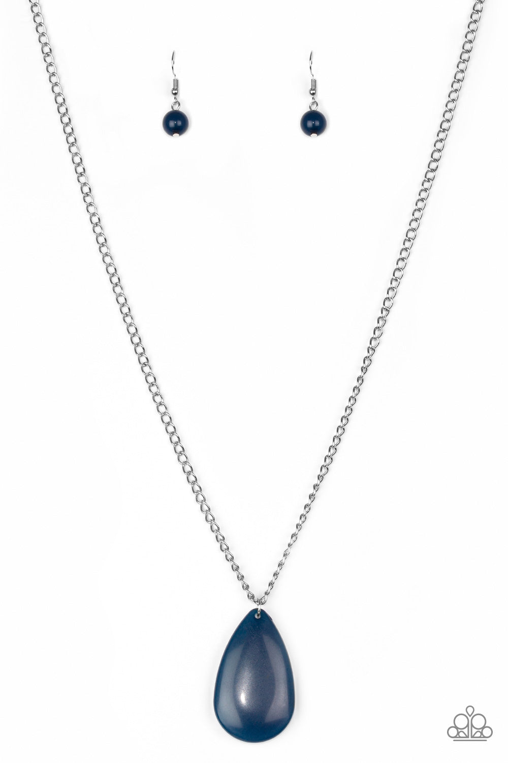 A refreshing blue teardrop pendant swings from the bottom of a lengthened silver chain, adding a perfect pop of color to any outfit. Features an adjustable clasp closure. Sold as one individual necklace. Includes one pair of matching earrings.
