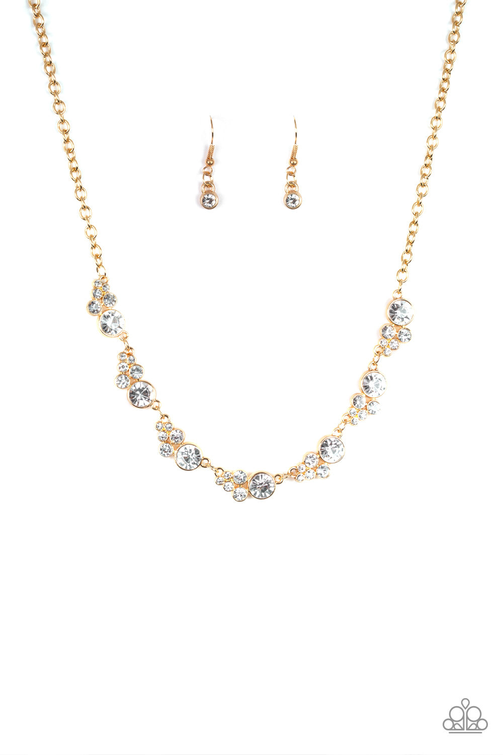 A collection of glassy white rhinestones coalesce into glittery golden frames as they link below the collar for a timeless shimmer. Features an adjustable clasp. Sold as one individual necklace. Includes one pair of matching earrings.