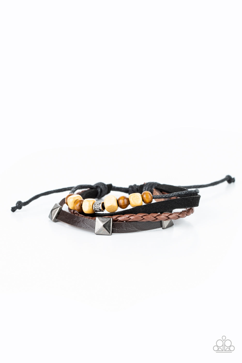Infused with mismatched metal and wooden accents, rows of black and brown suede and leather cords layer across the wrist for a rugged look. Features an adjustable sliding knot closure. Sold as one individual bracelet.