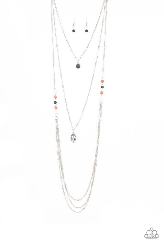 Multicolored stone beads give way to layers of shimmery silver chain down the chest. A black stone pendant and shiny silver frame drape above the cascade of silver chains for a seasonal flair. Features an adjustable clasp closure.
Sold as one individual necklace. Includes one pair of matching earrings.