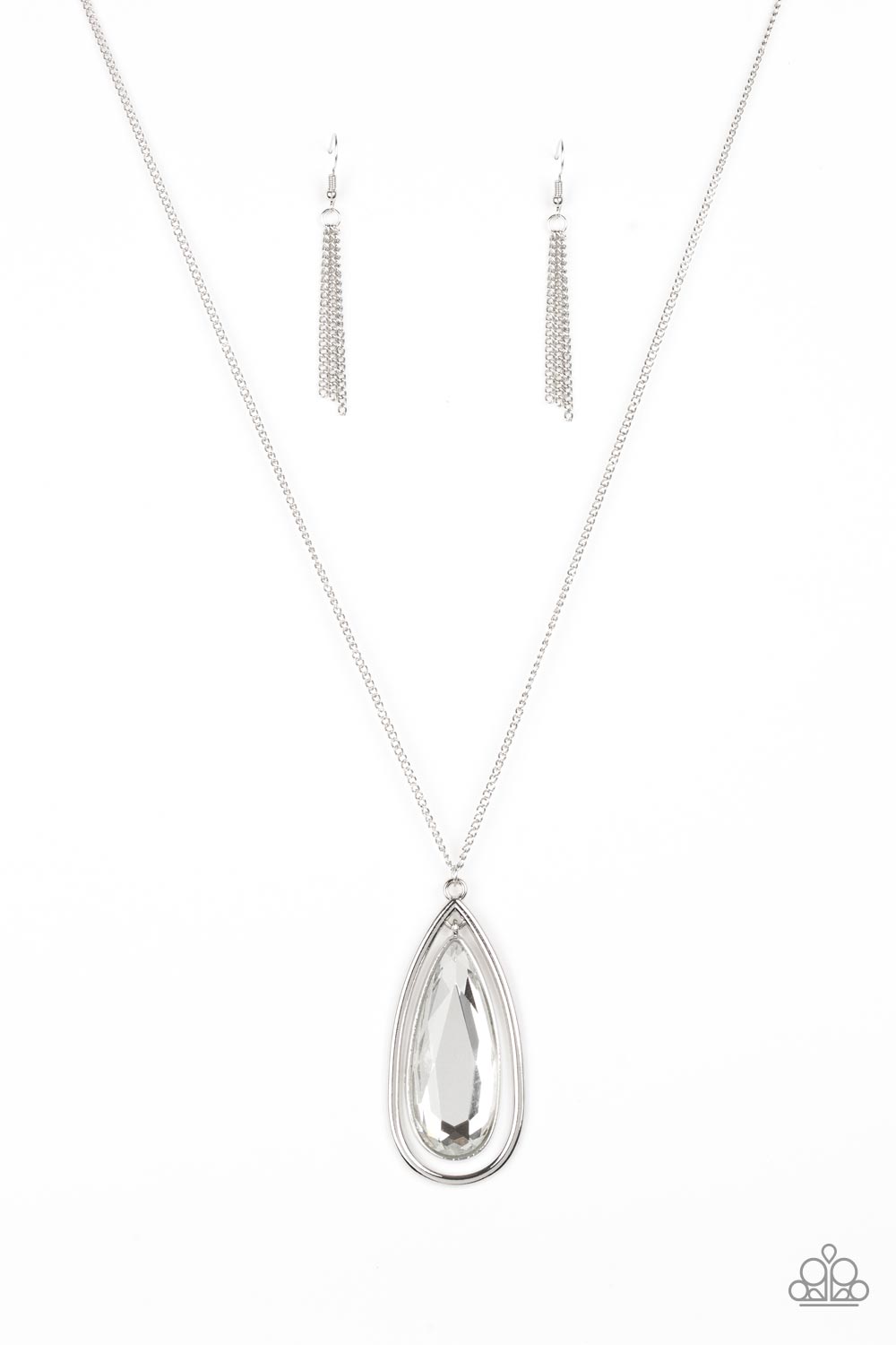An oversized white teardrop gem swings from the top of a glistening silver teardrop frame. The dramatic pendant swings from the bottom of an elegantly elongated silver chain for a regal finish. Features an adjustable clasp closure. Sold as one individual necklace. Includes one pair of silver fringe earrings.