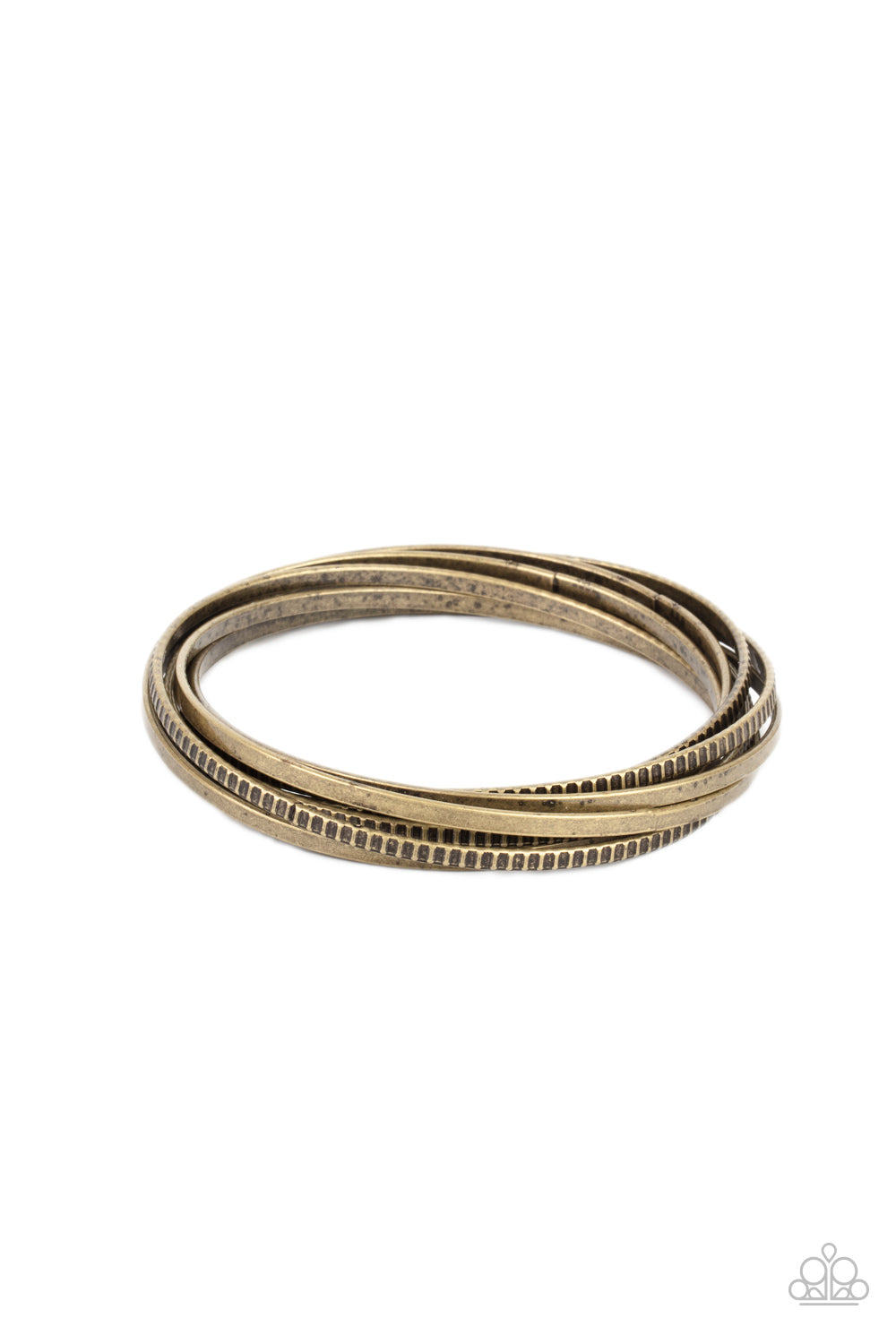 A set of four plain brass bangles interlocks with four brass bangles etched in a tread-like pattern, creating an edgy stacked look around the wrist. Sold as one individual bracelet.