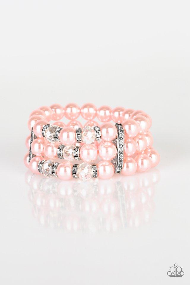 Pinched between white rhinestone encrusted frames, white rhinestone encrusted rings, crystal-beads, and pink pearls are threaded along elastic stretchy bands for a glamorous look. Sold as one individual bracelet.