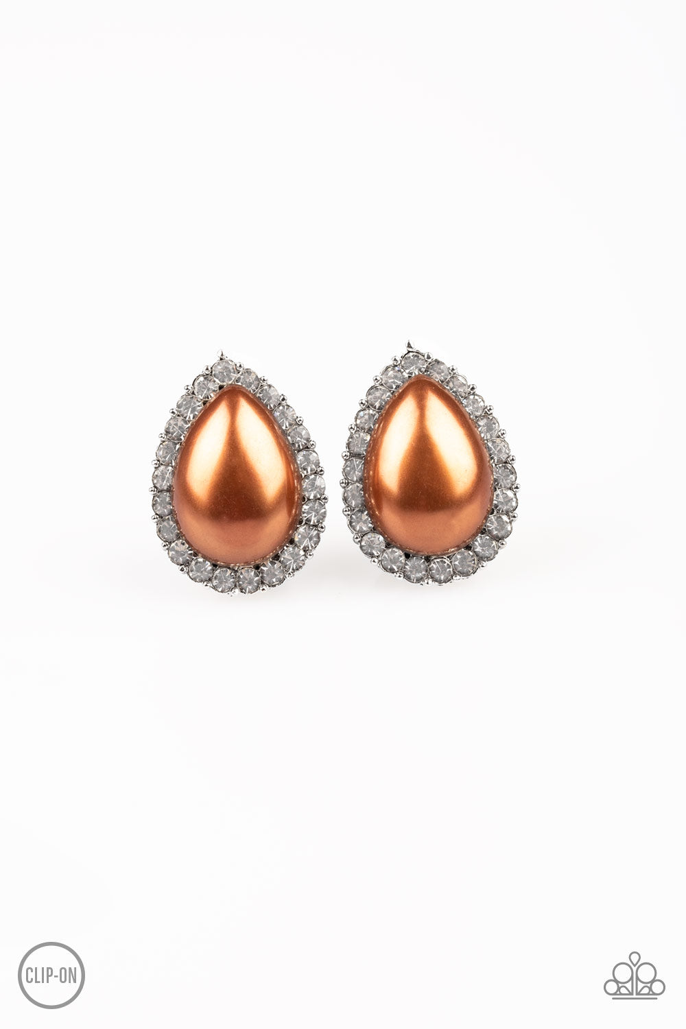 A ring of glassy white rhinestones spins around a pearly brown teardrop bead center, creating a timeless frame. Earring attaches to a standard clip-on earring. Sold as one pair of clip-on earrings.