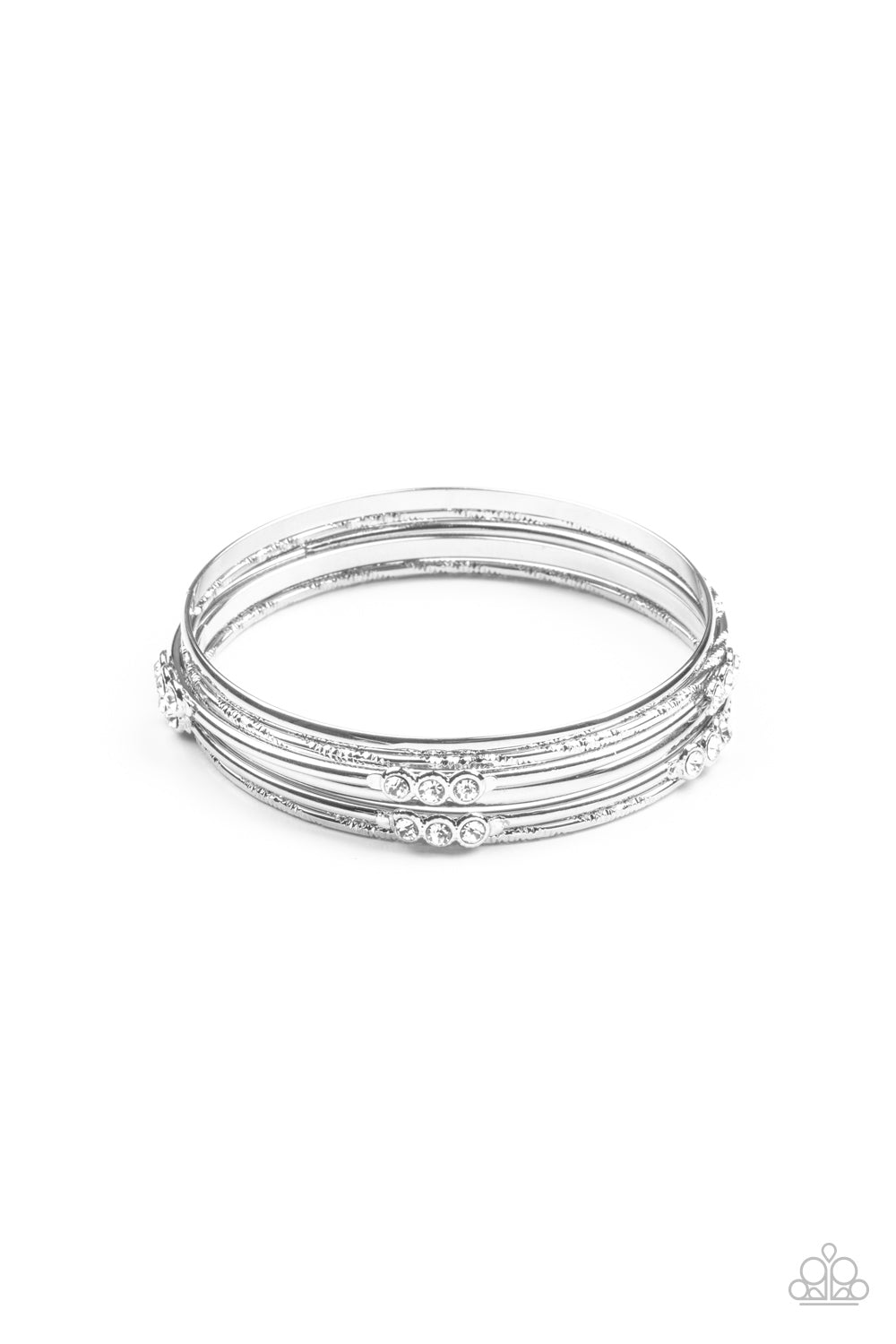 Pairs of plain, textured, and white rhinestone adorned silver bangles glide along the wrist for a sparkly look. Sold as one set of six bracelets.