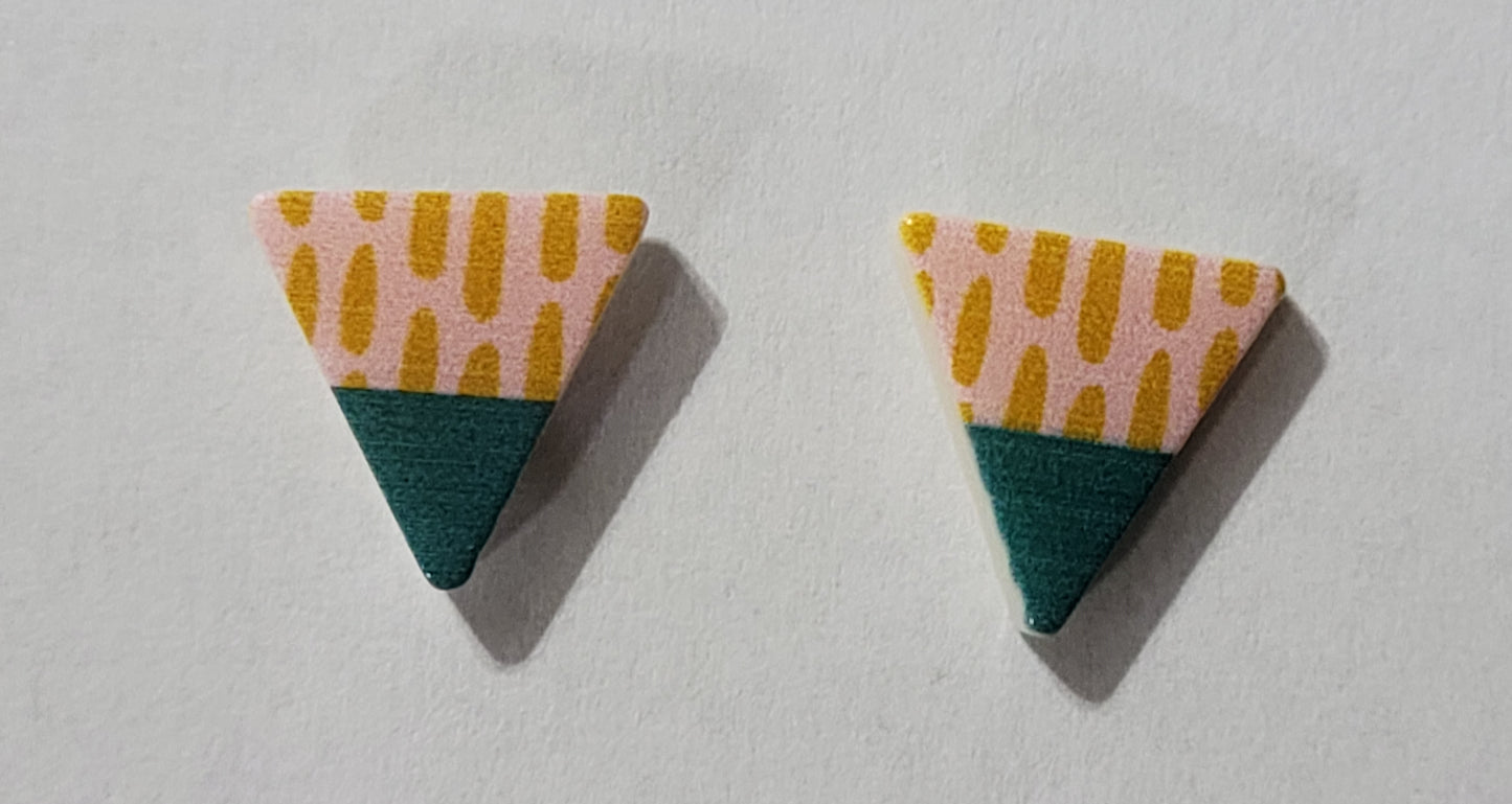 Kids' triangle shaped earrings with teal on one side and peach with darker peach stripes on the other