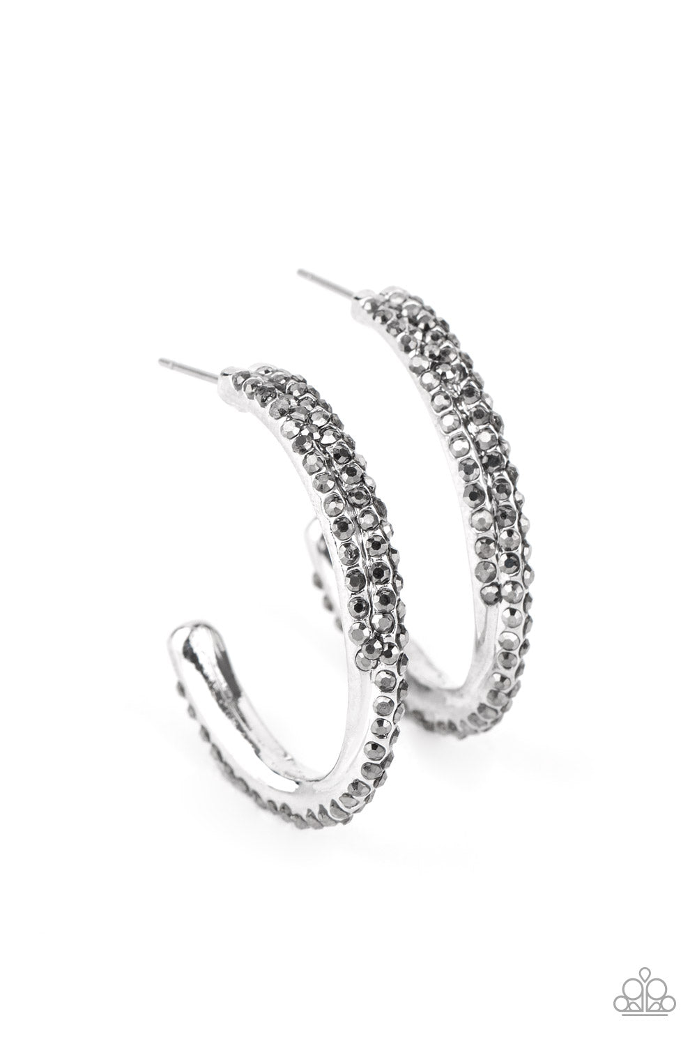 Two dainty rows of glittery white rhinestone encrusted silver bars delicately overlap and twist into a hook shaped hoop for a refined flair. Earring attaches to a standard post fitting. Hoop measures approximately 1" in diameter. Sold as one pair of hoop earrings.