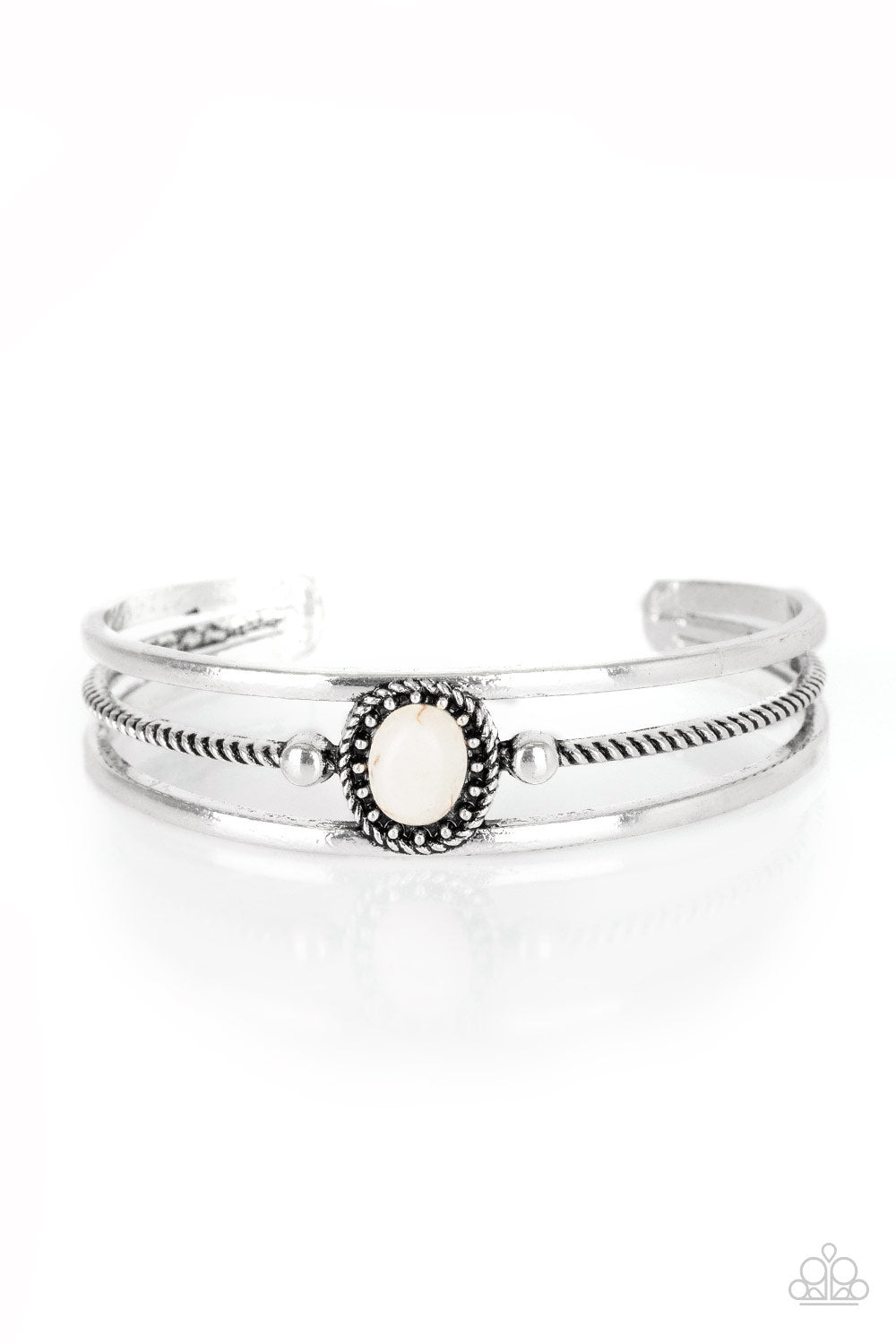 Serrated and smooth silver bars arc across the wrist, coalescing into an airy cuff. Infused with a studded frame, a refreshing white stone is pressed into the center of the cuff for a seasonal look. Sold as one individual bracelet.