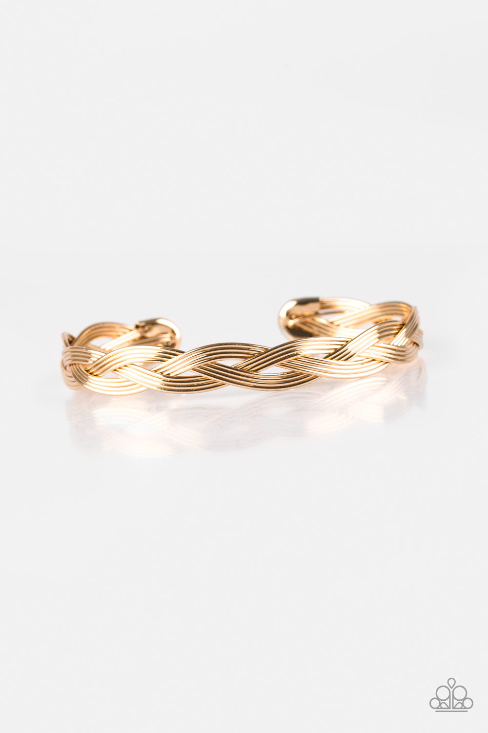 Glistening gold wires braid across the wrist, coalescing into a dainty cuff. Sold as one individual bracelet.