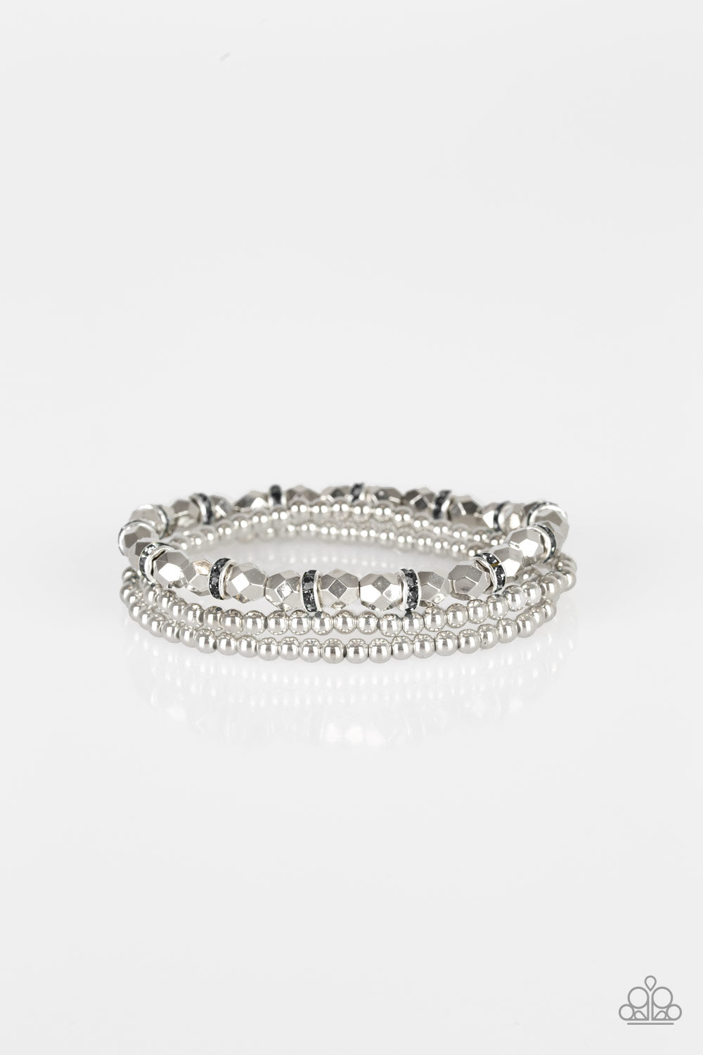 Infused with hematite rhinestone encrusted rings, mismatched dainty silver and faceted silver beads are threaded along stretchy bands for a refined look.
Sold as one set of three bracelets.