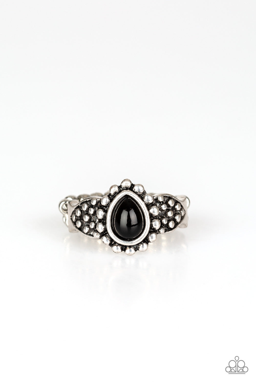 A teardrop black bead is pressed into the center of a dainty silver band radiating with studded patterns for a seasonal look. Features a dainty stretchy band for a flexible fit. Sold as one individual ring.