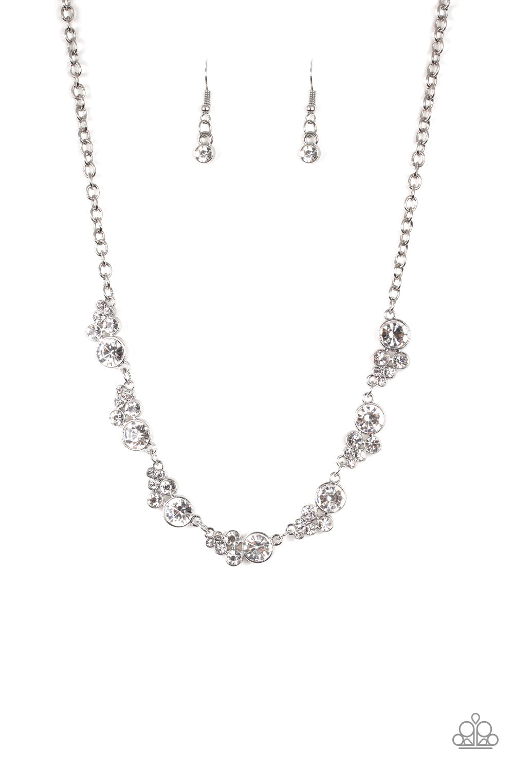 A collection of glassy white rhinestones coalesce into glittery silver frames as they link below the collar for a timeless shimmer. Features an adjustable clasp. Sold as one individual necklace. Includes one pair of matching earrings.