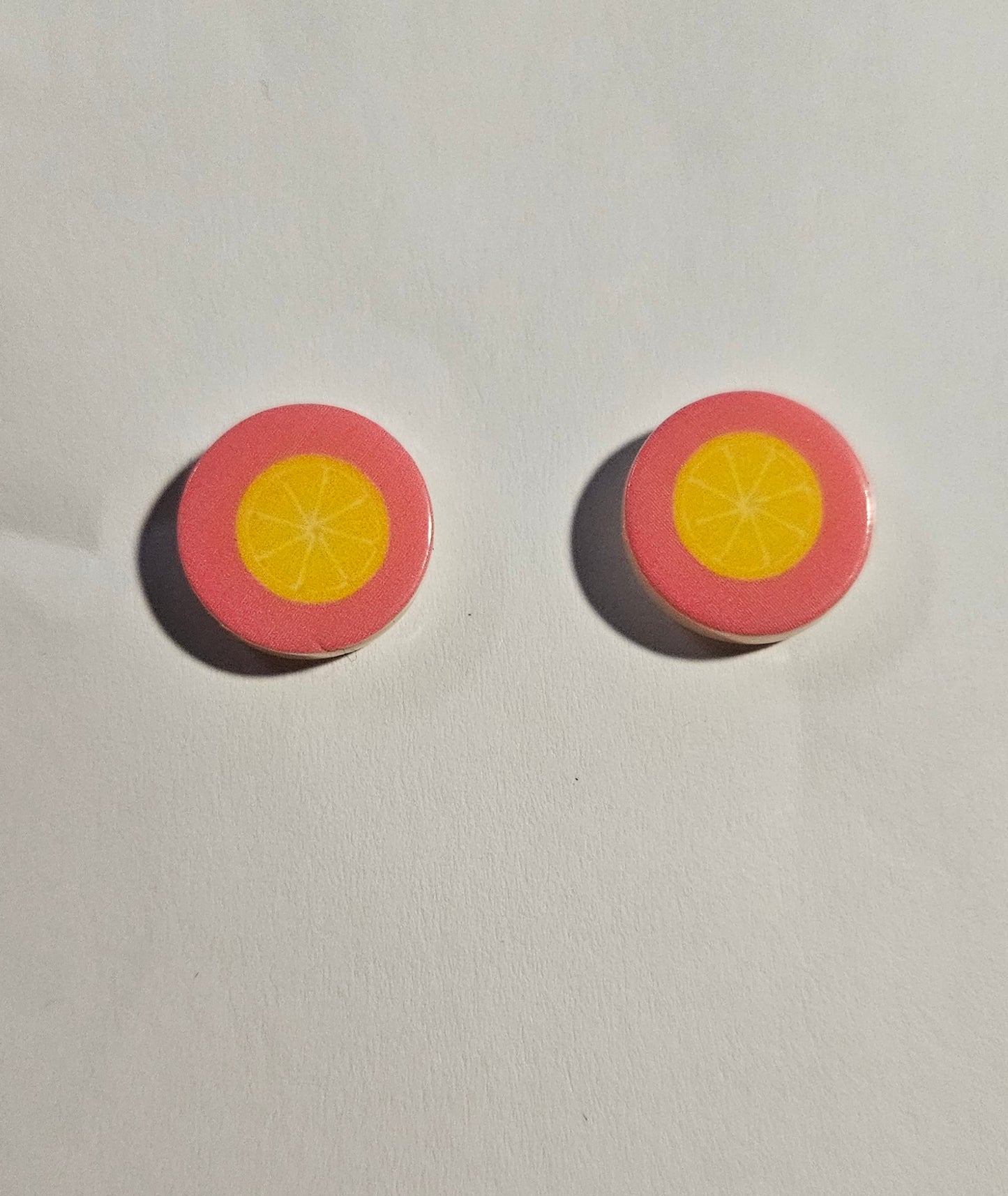 Kid's pink round earrings lemons in center