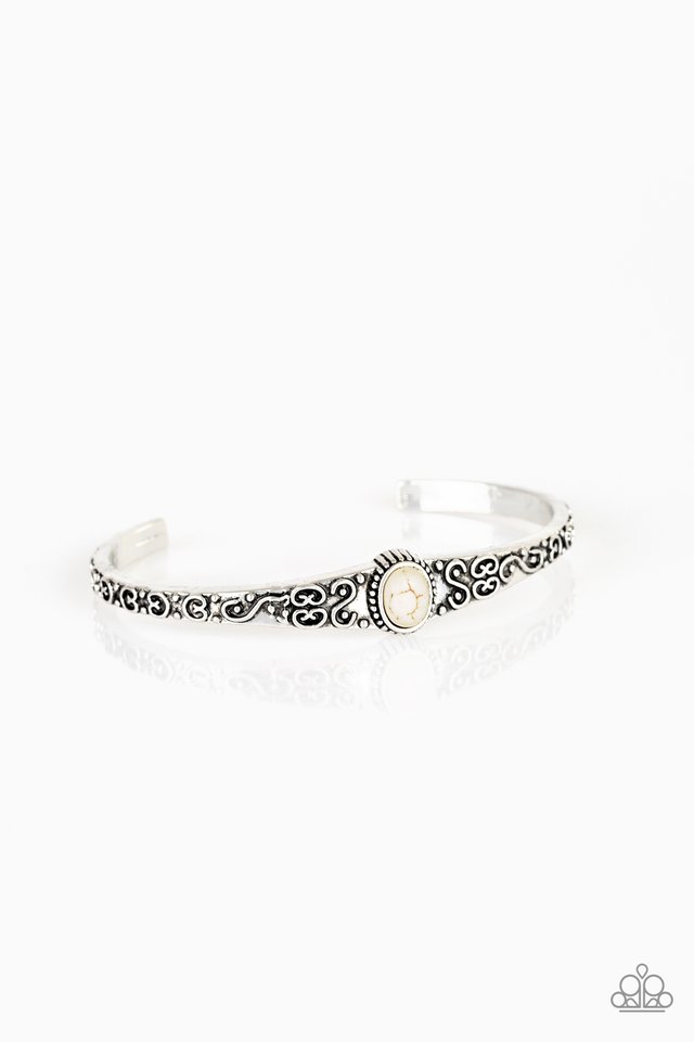 Infused with a refreshing white stone center, a dainty silver cuff has been embossed in swirling antiqued detail for a seasonal look. Sold as one individual bracelet.