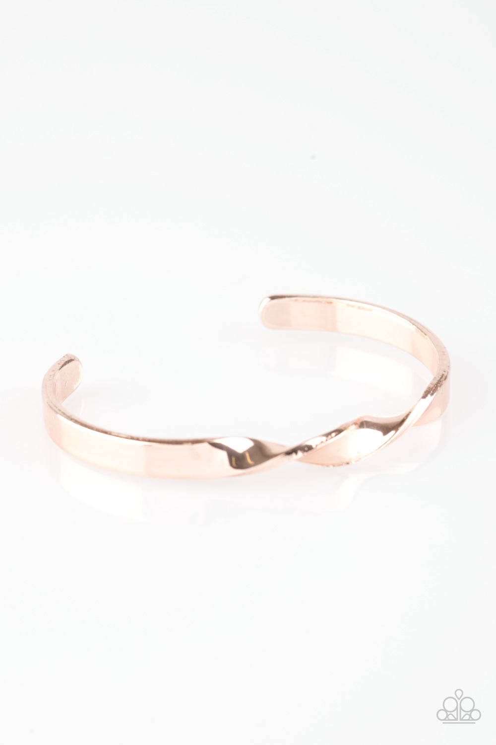 Brushed in a high-sheen finish, a dainty rose gold bar subtly twists at the center, creating a casual cuff. Sold as one individual bracelet.