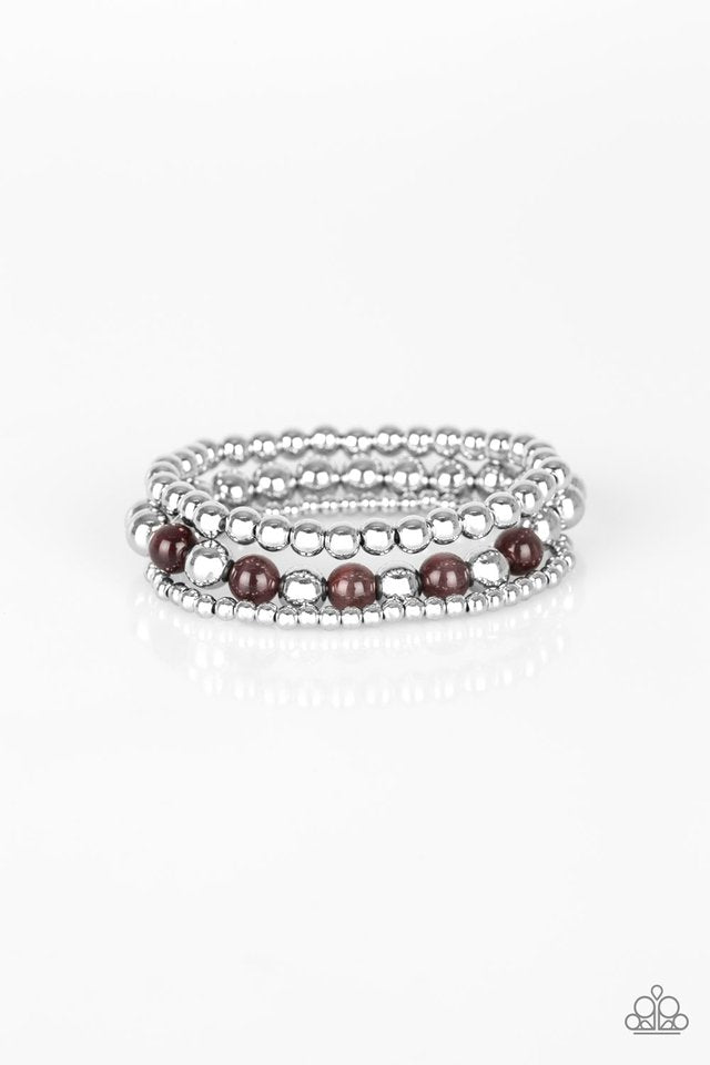 Infused with glowing purple moonstones, shiny silver beads are threaded along stretchy bands for a whimsical look.
Sold as one individual bracelet.